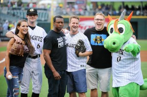 Caprice Coleman of Ring of Honor, Kelly Klein of Women of Honor, and Ian Riccaboni, ROH Broadcaster, with Knights pitcher Connor Walsh and Homer the Dragon after their first pitches